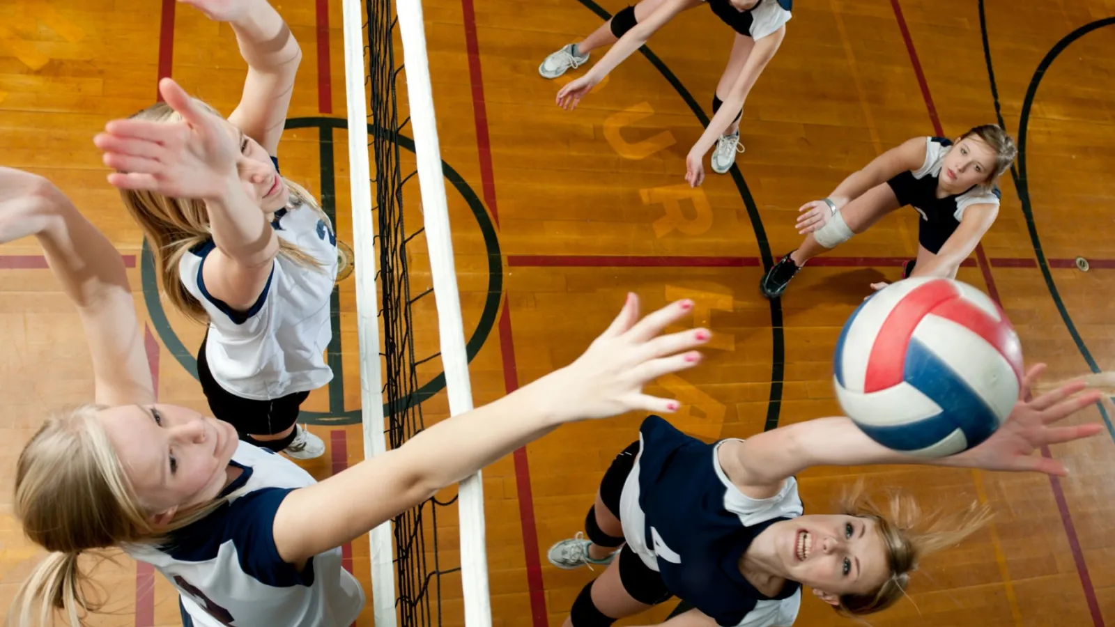 overhead of girls playing volleyball