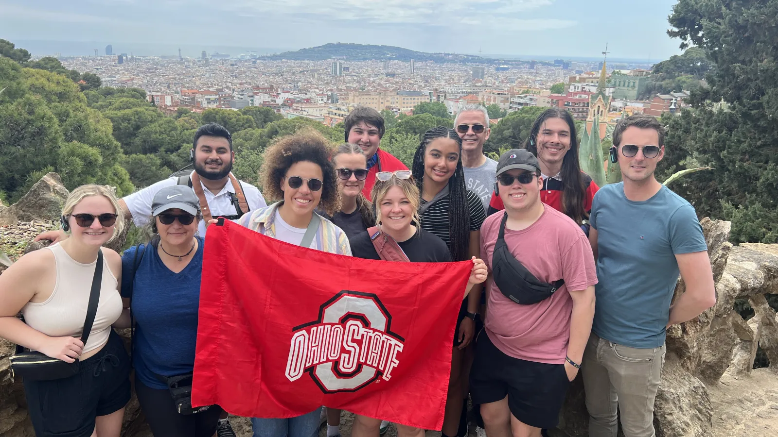 Students pose with flag