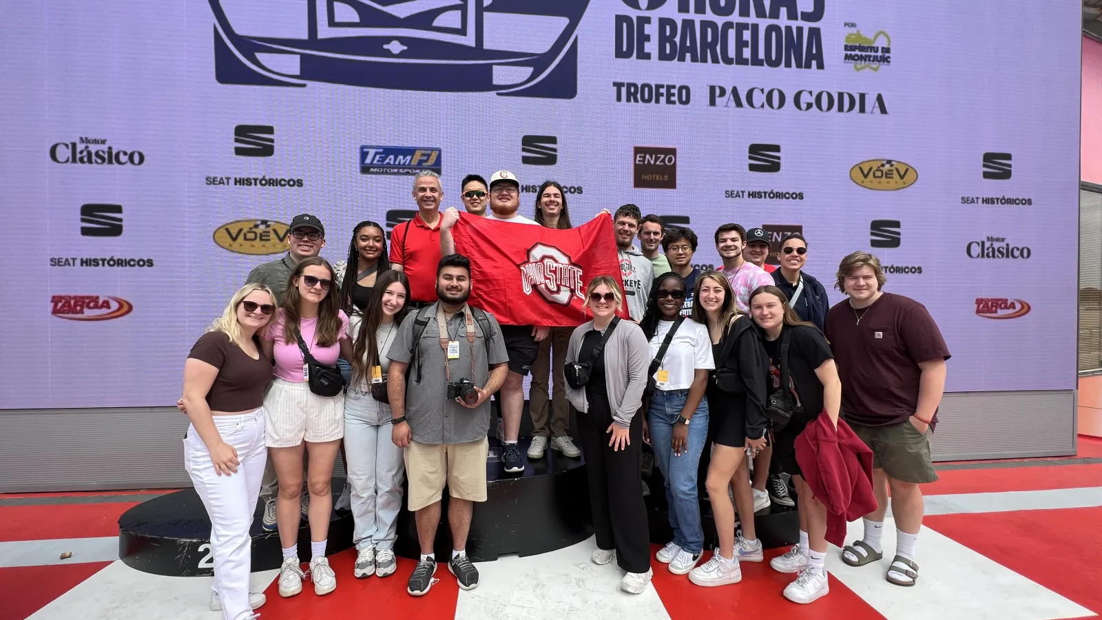 Students stand on race podium
