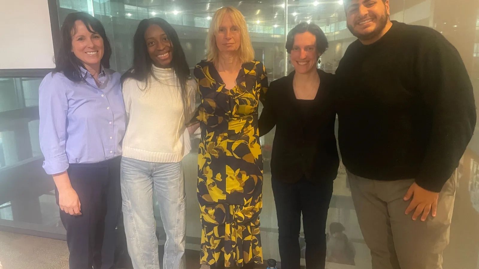 five people standing in a row at Transgender Athlete event