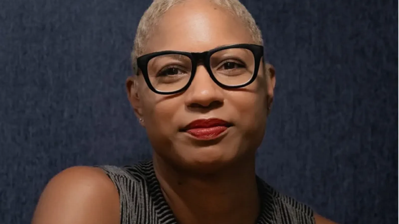 Photo of woman with short hair and glasses