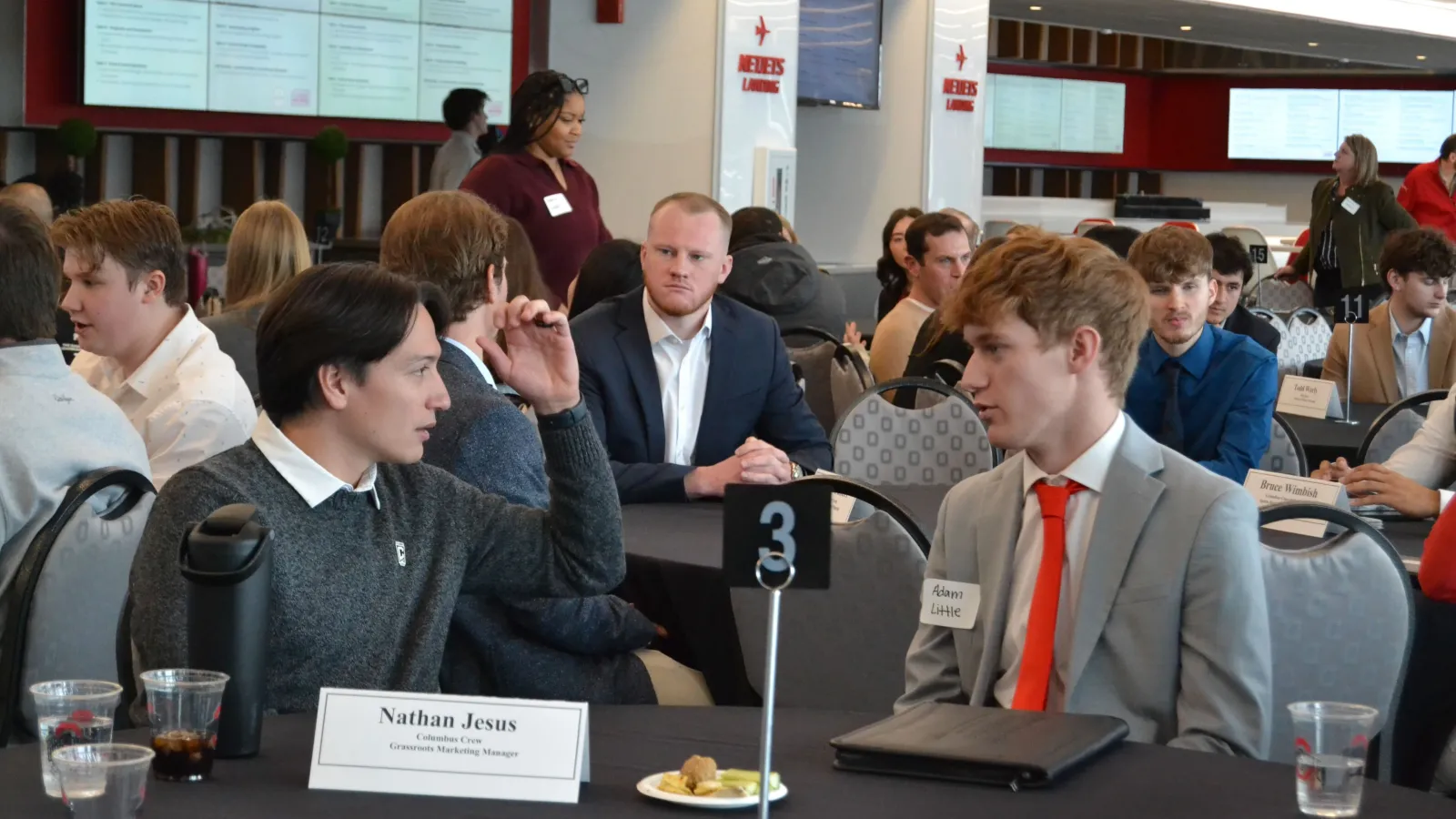 Students sit at table