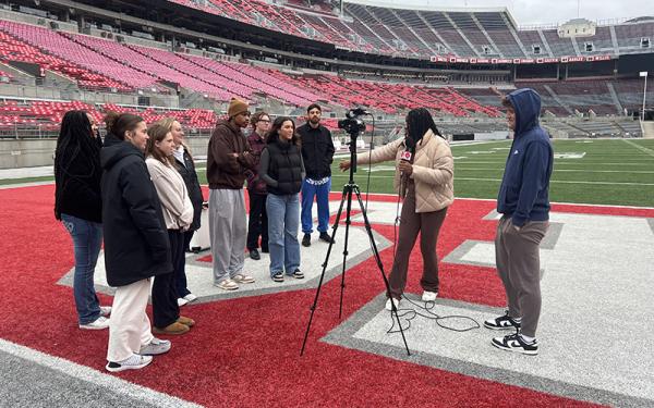 Students learning video on field