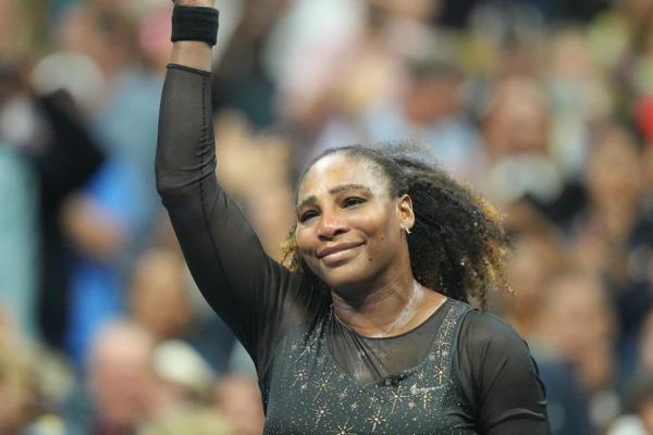 Serena Williams waves goodbye