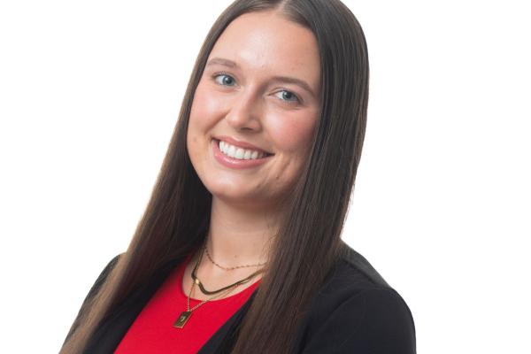woman in red short with long dark hair