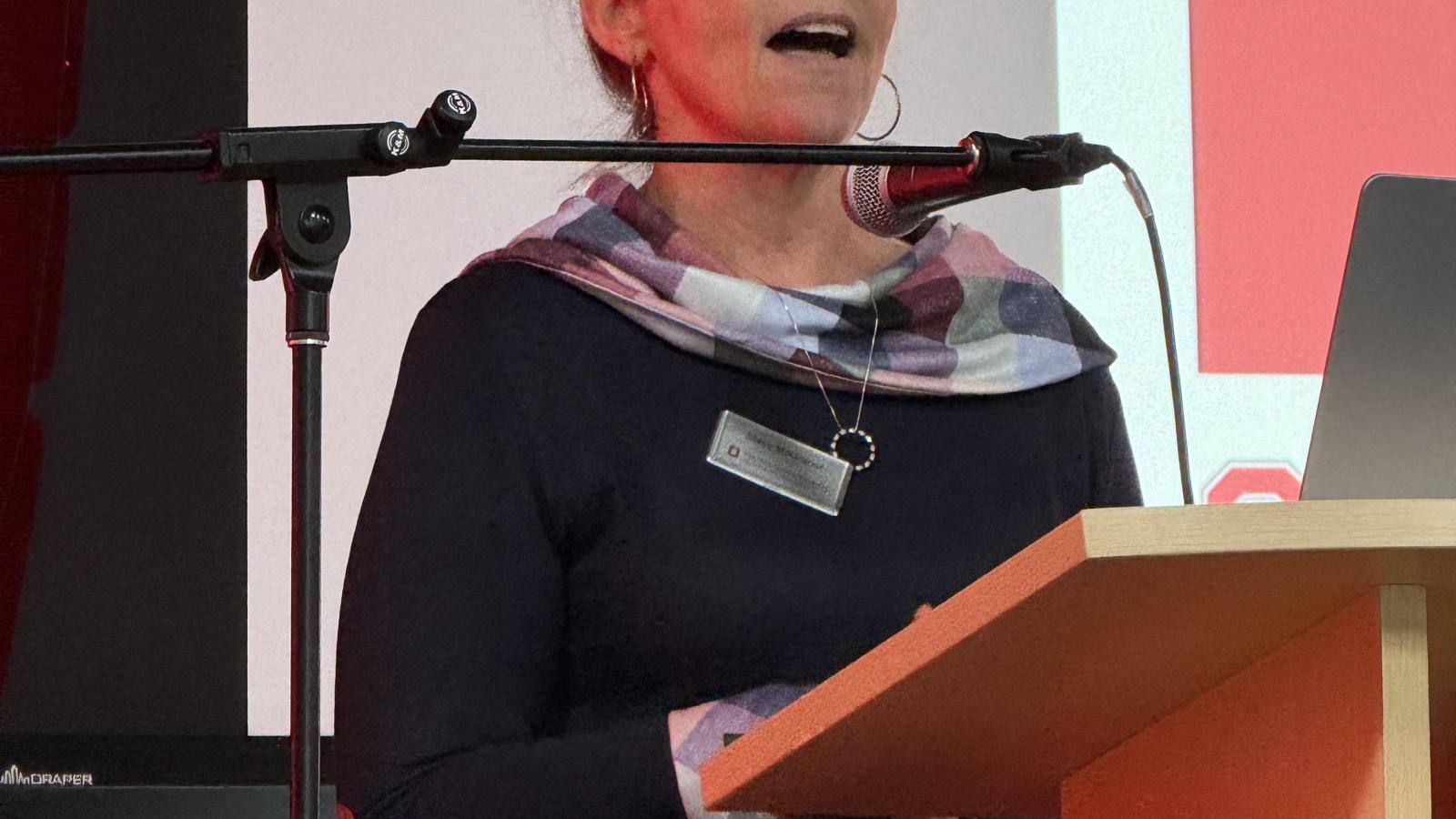woman speaking at microphone
