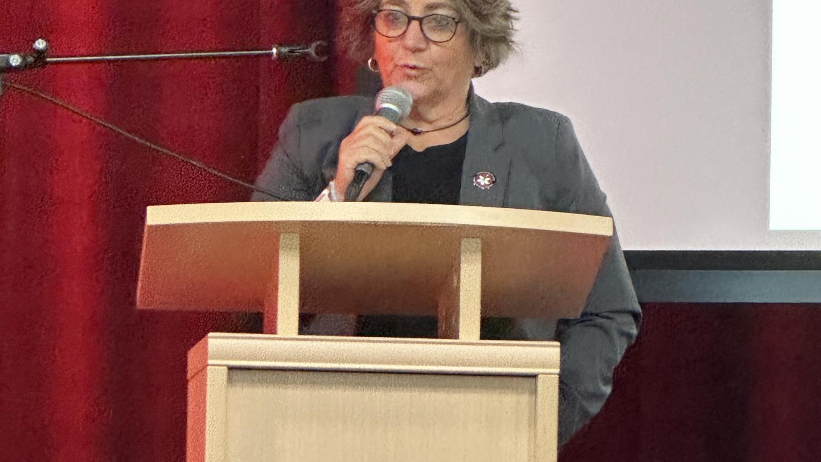 Woman at podium