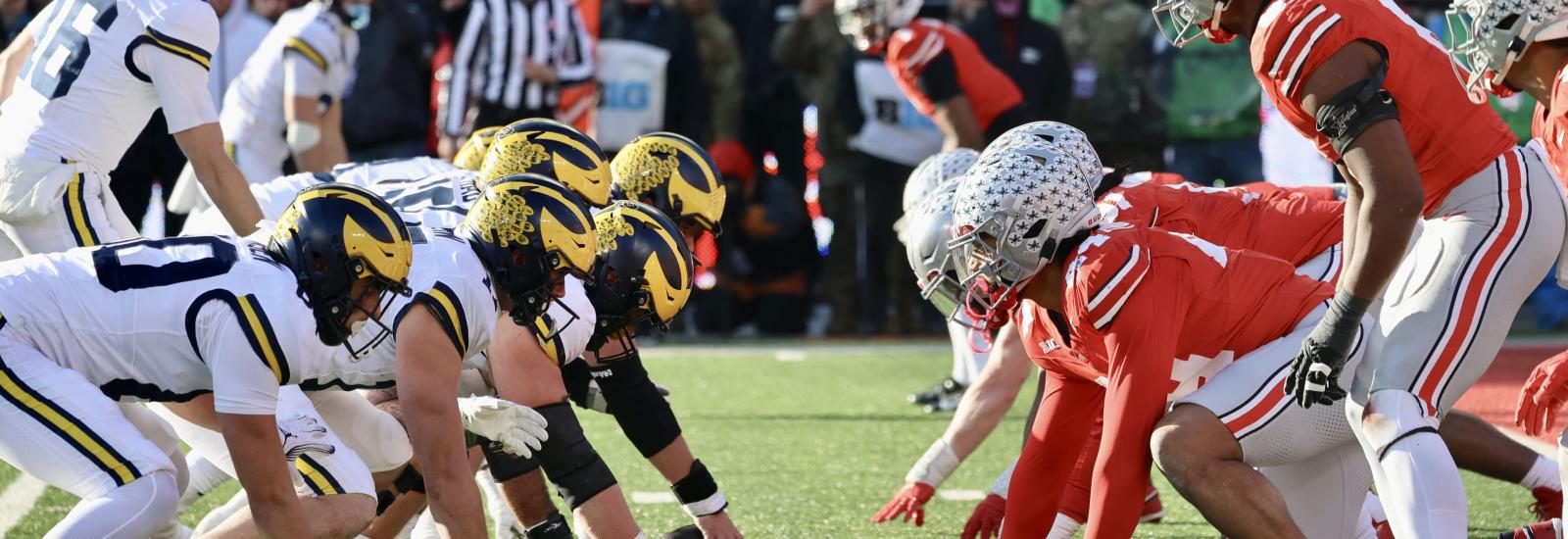 Football players facing off at line of scrimmage